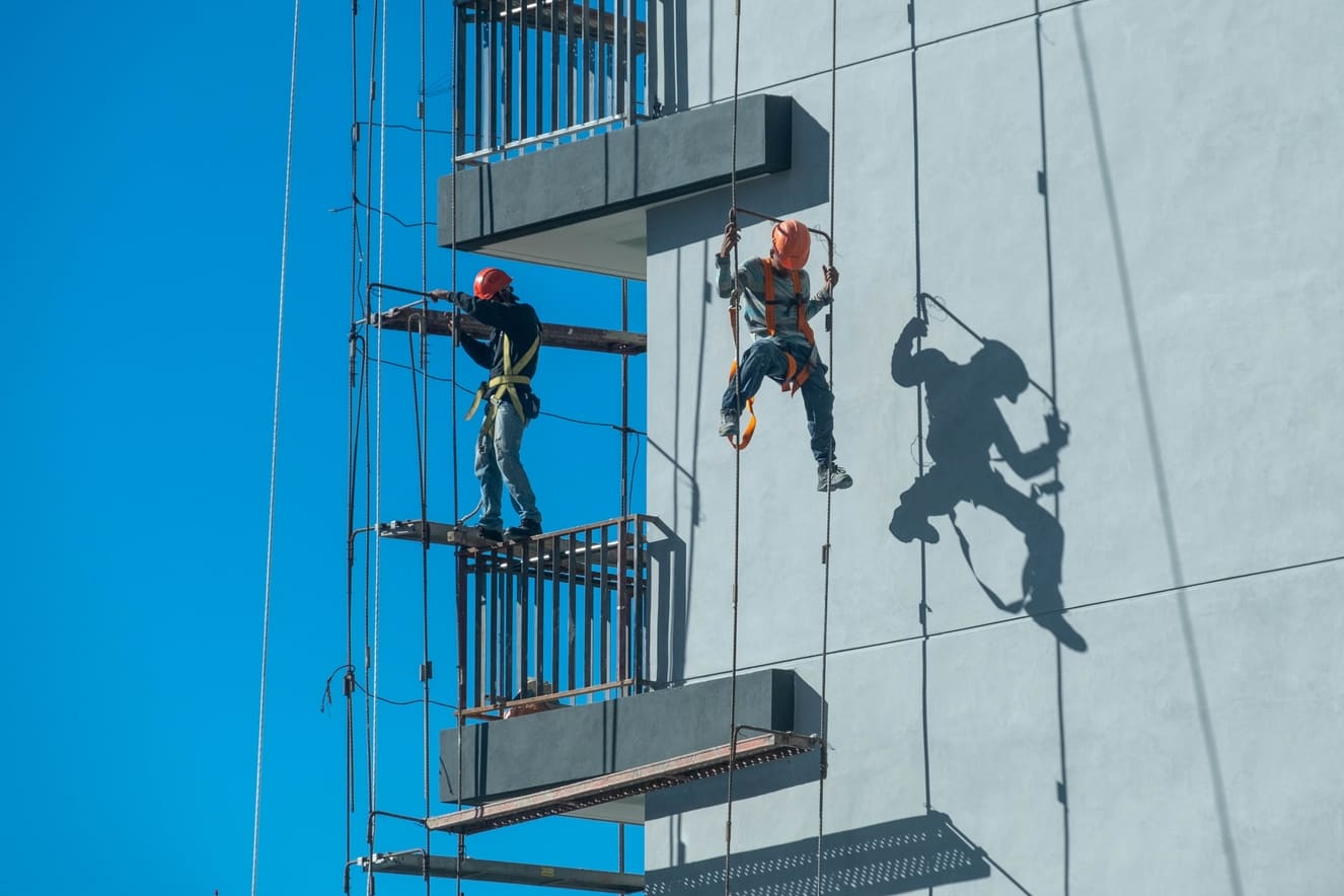 couple-workers-fixing-climbing-scaffolding-while-following-all-safety-measures valem blog